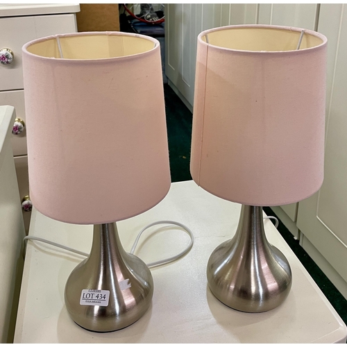 342 - A PAIR OF DUNELM CHROMED TOUCH BEDSIDE LAMPS WITH PINK SHADES