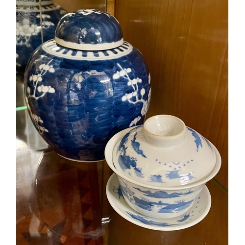 275 - A CHINESE BLUE AND WHITE COVERED GINGER JAR, 2 X BLUE RINGS TO BASE, PRUNUS DESIGN AND A JAPANESE BL... 