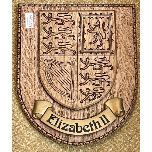 294 - AN UNUSUAL CARVED LIGHT OAK SHIELD WITH THE COATS OF ARMS OF THE UNITED KINGDOM MARKED ELIZABETH II,... 