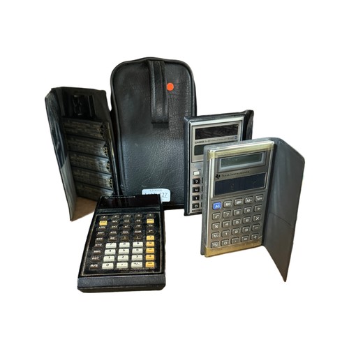 427 - A QTY OF VINTAGE CALCULATORS INCL, A TI PROGRAMMABLE 58 SOLID STATE SOFTWARE CALCULATOR WITH MANUAL,... 