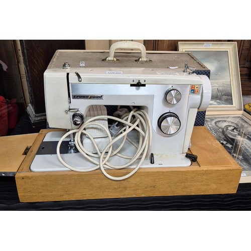 299 - A CROWN POINT ELECTRIC SEWING MACHINE AND COVER WITH POWER LEAD