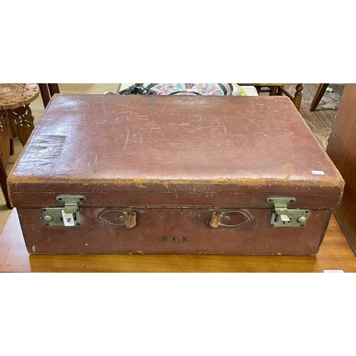 311 - A VINTAGE FITTED LEATHER SUITCASE -MISSING HANDLE AND THREE INITIALS INCISED TO THE FRONT