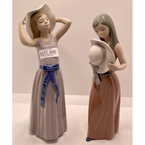 490 - TWO (2) LLADRO FIGURINES - 5007 - BASHFUL GIRL WITH STRAW HAT AND 5011 GIRL TRYING ON A STRAW HAT