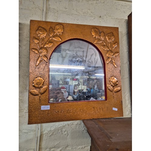 350 - A COPPER COVERED FRAMED MIRROR WITH FIGURATIVE PICTURE ON GLASS - ROSE DESIGN TO COPPER SURROUND