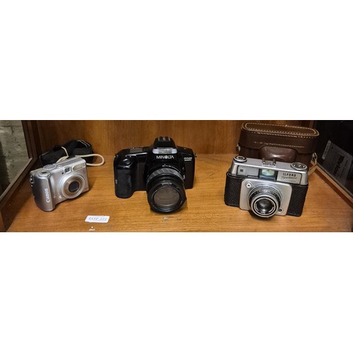 371 - AN ILFORD SPORTS MASTER CAMERA, A CANNON POWER SHOT DIGITAL CAMERA AND A MINALTA DYNAX 5000I DIGITAL... 