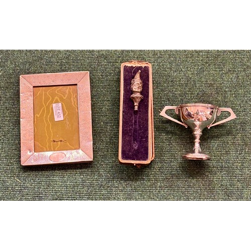 432 - A HALLMARKED SILVER PHOTO FRAME, A HALLMARKED SILVER TROPHY AND A SILVER BABY'S RATTLE TOP IN THE FO... 