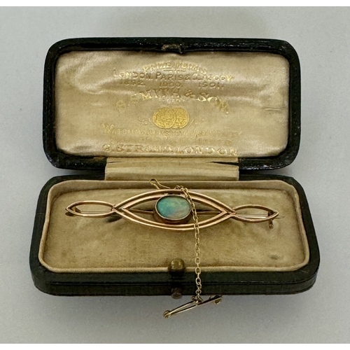 310A - AN EDWARDIAN BAR BROOCH WITH CENTRAL OPAL IN GOLD (NOTE GOLD UNMARKED BUT TESTED AS 9CT) - WITH WHIT... 