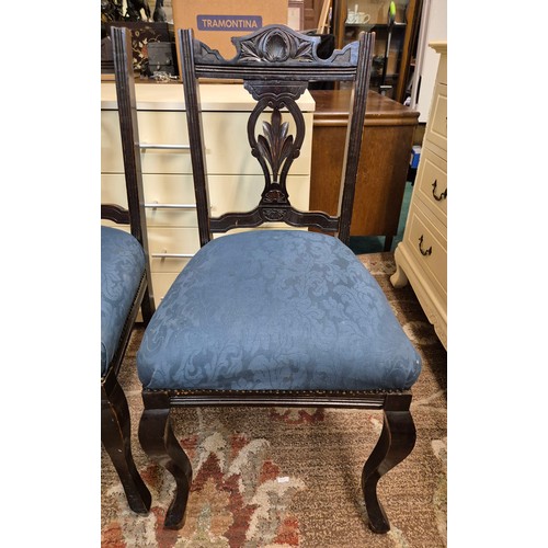 315 - A PAIR OF VICTORIAN CARVED BACK CHAIRS WITH BLUE BROCADE UPHOLSTERY