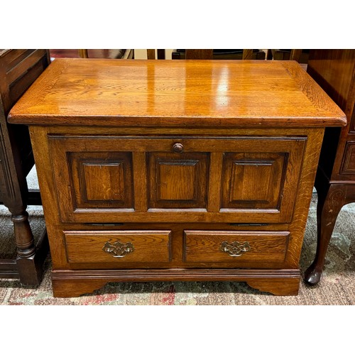 319 - A HEAVY OAK FALL FRONT CABINET IN THE FORM OF A COFFER, A DROP FRONT CUPBARD ABOVE TWO DRAWERS 82CM ... 