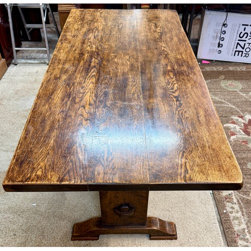 322 - A PLANK OAK REFECTORY DINING TABLE -A RECTANGULAR DINING TABLE OF OAK PLANK CONSTRUCTION ON A RAISED... 