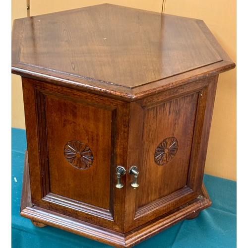 323 - A HEAVY OAK HEXAGONAL LAMP TABLE WITH TWIN DOOR CABINET BELWO 51CM H X 64CM L X 55CM W