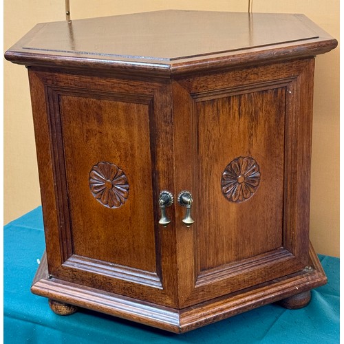 323 - A HEAVY OAK HEXAGONAL LAMP TABLE WITH TWIN DOOR CABINET BELWO 51CM H X 64CM L X 55CM W