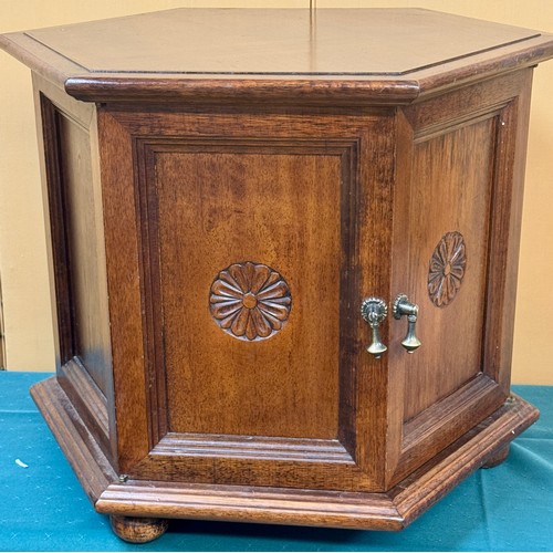 323 - A HEAVY OAK HEXAGONAL LAMP TABLE WITH TWIN DOOR CABINET BELWO 51CM H X 64CM L X 55CM W