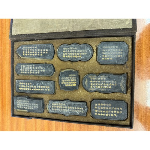 426 - A SET OF 10 CHINESE INK BLOCKS CASED -EACH BLOCK WITH A DESCRIPTION TO THE REAR- THE COVER MARKED 'T... 