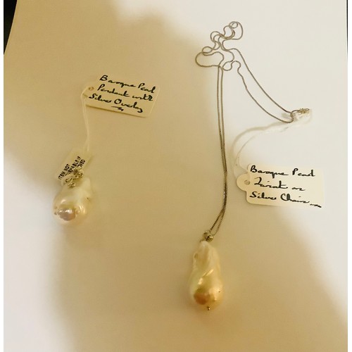 469 - LARGE BAROQUE PEARL LARIAT ON A SILVER CHAIN TOGETHER WITH A LARGE BAROQUE PEARL PENDANT WITH SILVER... 