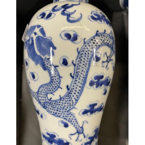 423 - TWO 19TH CENTURY CHINESE BLUE & WHITE VASES - H:22CMS & 19.5CMS ONE WITH DRAGON DESIGN AND THE OTHER... 