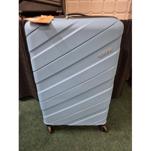 203 - AMERICAN TOURISTER LARGE SUITCASE JET DRIVER 3 IN LIGHT BLUE