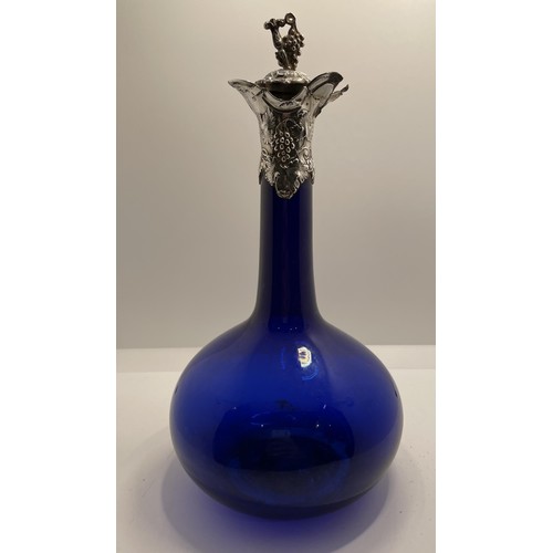 456 - A GEORGIAN BRISTOL BLUE GLASS DOUBLE POURER WINE DECANTER WITH HALLMARKED SILVER COLLAR SHOWING VINE... 