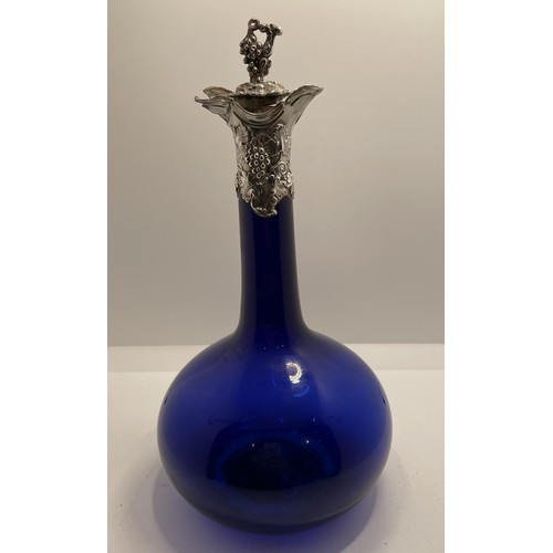 456 - A GEORGIAN BRISTOL BLUE GLASS DOUBLE POURER WINE DECANTER WITH HALLMARKED SILVER COLLAR SHOWING VINE... 