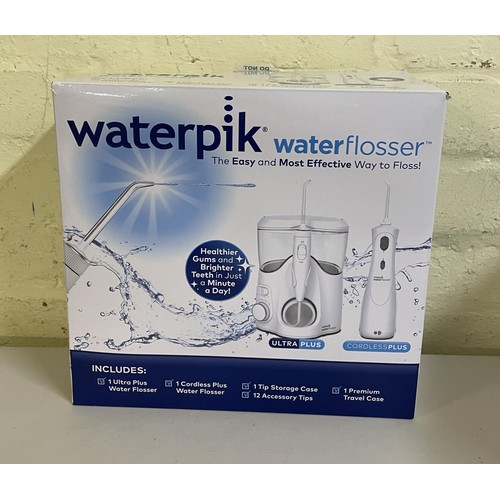 17 - BOXED WATERPIK WATER FLOSSER WITH ULTRA PLUS/CORDLESS PLUS WITH ACCESSORIES