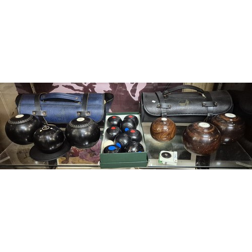 379 - A SET OF LIGNUM VITAE CROWN GREEN BOWLS & 1 OTHER -BOTH IN STORAGE CASES, TOGETHER WITH A BOXED CARP... 