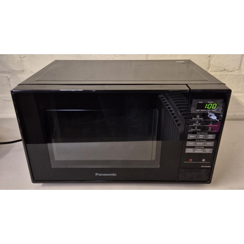 73 - PANASONIC MICROWAVE NN-E28JBM IN BLACK - PREVIOUS USE