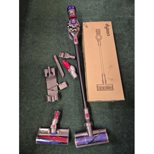 105 - BOXED DYSON V8 TOTAL CLEAN STICK VACUUM CLEANER WITH 2 HEADS, WALL MOUNT AND CHARGER AND X3 ACCESSOR... 
