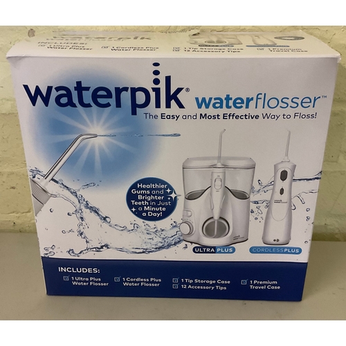 32 - BOXED WATERPIK WATERFLOSSER WITH ULTRA PLUS AND CORDLESS PLUS