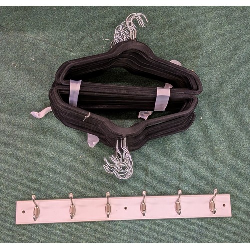 152 - SET OF 50 NON SLIP HANGERS TOGETHER WITH A 6 HOOK COAT RACK