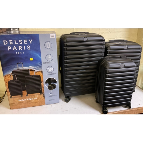 219 - BOXED DELSEY PARIS HELIUM EDGE 2.0 3 PIECE LUGGAGE SET - TEXTURED BLACK - LARGE, MEDIUM, AND SMALL