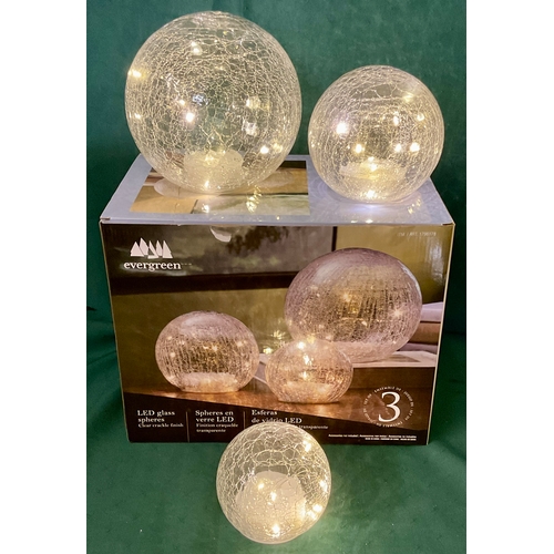 240 - BOXED EVERGREEN SET OF THREE LED GLASS SPHERES WITH CLEAR CRACKLE FINISH
