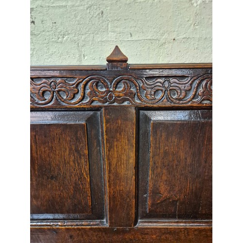 283 - AN ANTIQUE OAK VICTORIAN CARVED BENCH, IN THE JACOBEAN REVIVAL STYLE, HIGH PANELLED BACK WITH HEAVIL... 