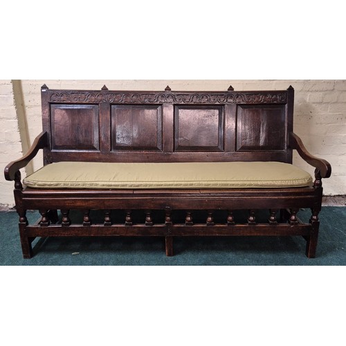 283 - AN ANTIQUE OAK VICTORIAN CARVED BENCH, IN THE JACOBEAN REVIVAL STYLE, HIGH PANELLED BACK WITH HEAVIL... 