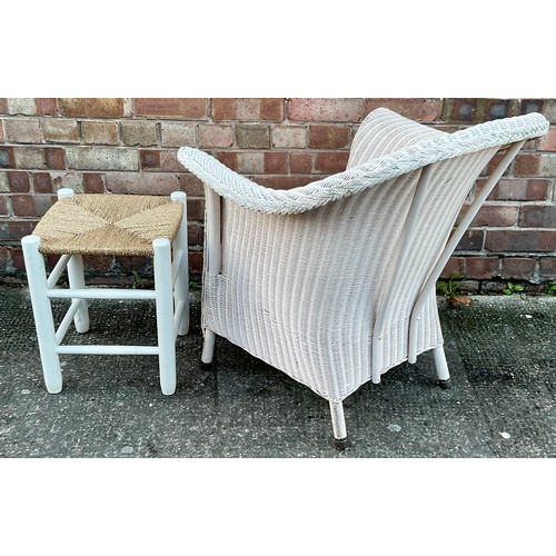 324 - A LLOYD LOOM WICKER ARMCHAIR IN WHITE WITH A WHITE PAINTED AND WICKER FOOT STOOL