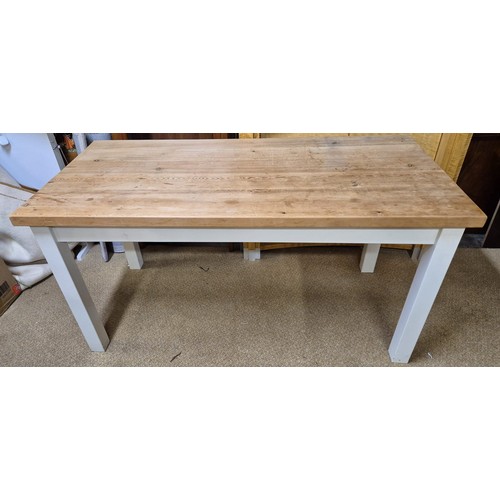 316 - A VINTAGE WHITE PAINTED PINE KITCHEN TABLE, FOUR SQUARE PAINTED LEGS BELOW PINE TOP - APPROX 152.CM.... 