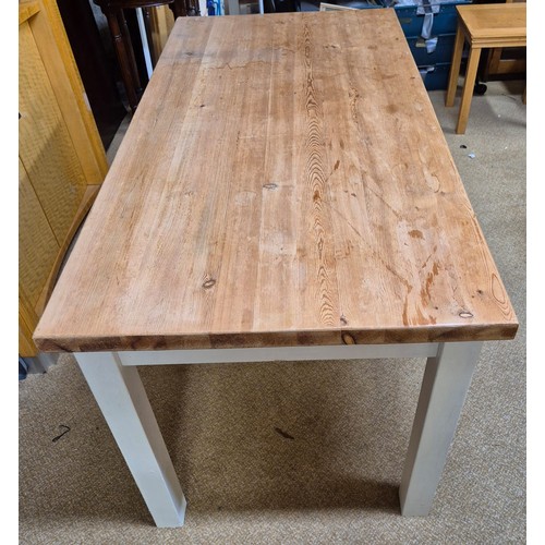 316 - A VINTAGE WHITE PAINTED PINE KITCHEN TABLE, FOUR SQUARE PAINTED LEGS BELOW PINE TOP - APPROX 152.CM.... 