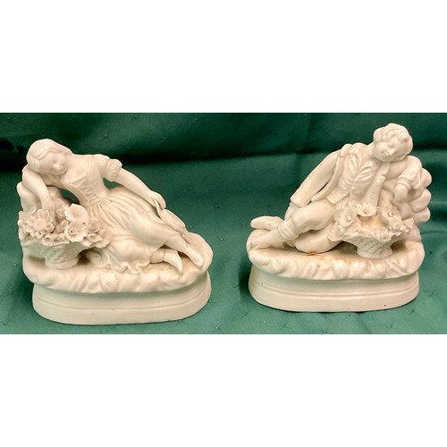 438 - X2 VICTORIAN PARIAN WARE FIGURINES OF A BOY AND GIRL EACH LAYING AMONGST FLOWERS CONTENTEDLY (NOTE: ... 