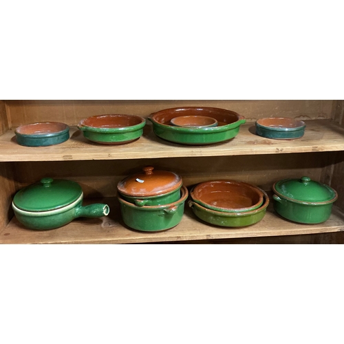 449 - A COLLECTION OF GREEN GLAZED SPANISH STONEWARE COOKING UTENSILS