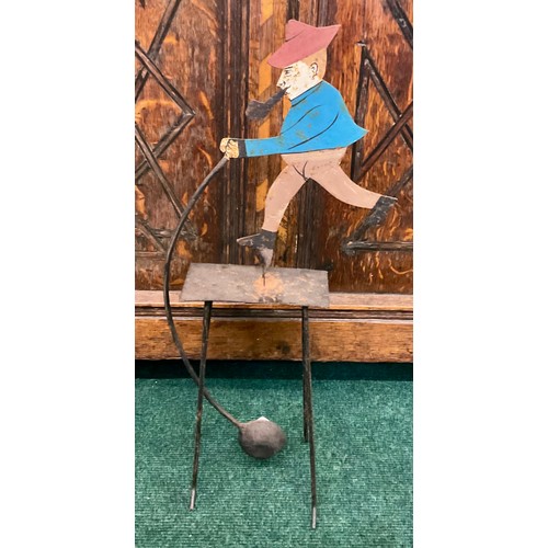 418A - A VINTAGE METAL BALANCE TOY OF A MAN IN BLUE SMOKING A PIPE
