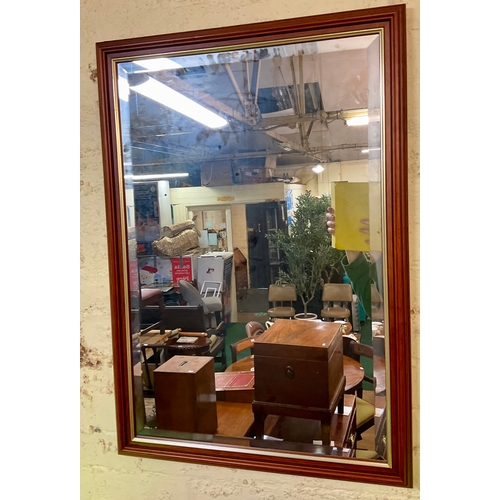 329A - A MAHOGANY RECTANGULAR FRAMED MIRROR WITH GUILT RIM TO PLATE  83CM H X 59CM W