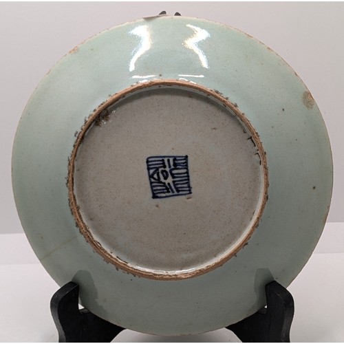 471 - A QING DYNASTY FAMILLE ROSE CELADON GROUND PLATE DECORATED WITH BIRDS, BUTTERFLIES, FLOWERS ETC WITH... 