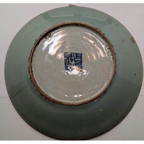 471 - A QING DYNASTY FAMILLE ROSE CELADON GROUND PLATE DECORATED WITH BIRDS, BUTTERFLIES, FLOWERS ETC WITH... 