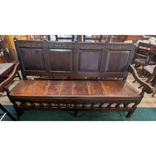 283 - AN ANTIQUE OAK VICTORIAN CARVED BENCH, IN THE JACOBEAN REVIVAL STYLE, HIGH PANELLED BACK WITH HEAVIL... 