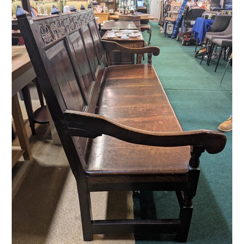283 - AN ANTIQUE OAK VICTORIAN CARVED BENCH, IN THE JACOBEAN REVIVAL STYLE, HIGH PANELLED BACK WITH HEAVIL... 