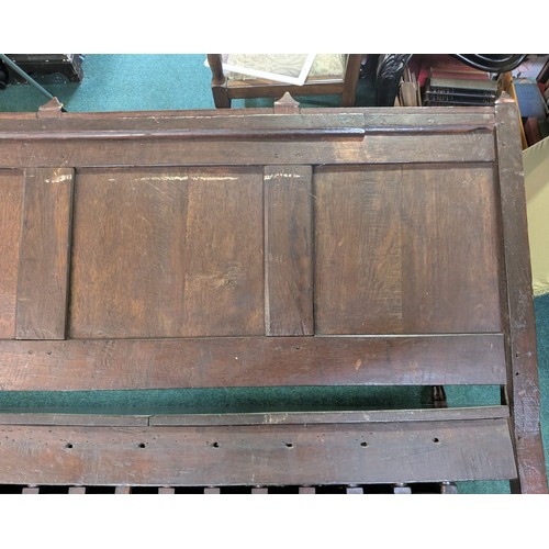 283 - AN ANTIQUE OAK VICTORIAN CARVED BENCH, IN THE JACOBEAN REVIVAL STYLE, HIGH PANELLED BACK WITH HEAVIL... 