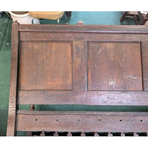 283 - AN ANTIQUE OAK VICTORIAN CARVED BENCH, IN THE JACOBEAN REVIVAL STYLE, HIGH PANELLED BACK WITH HEAVIL... 