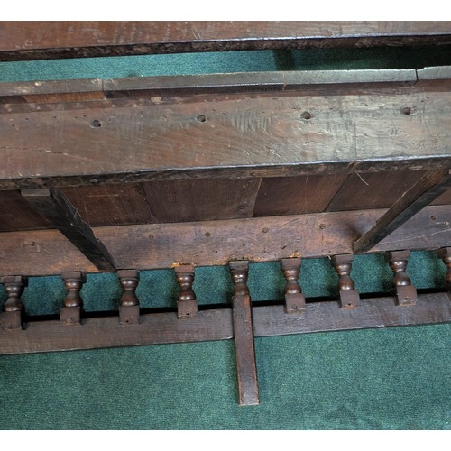 283 - AN ANTIQUE OAK VICTORIAN CARVED BENCH, IN THE JACOBEAN REVIVAL STYLE, HIGH PANELLED BACK WITH HEAVIL... 