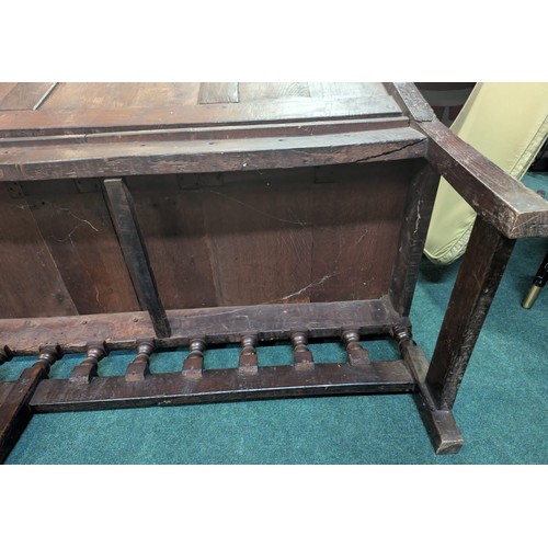 283 - AN ANTIQUE OAK VICTORIAN CARVED BENCH, IN THE JACOBEAN REVIVAL STYLE, HIGH PANELLED BACK WITH HEAVIL... 