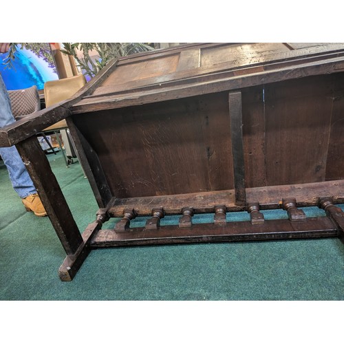 283 - AN ANTIQUE OAK VICTORIAN CARVED BENCH, IN THE JACOBEAN REVIVAL STYLE, HIGH PANELLED BACK WITH HEAVIL... 