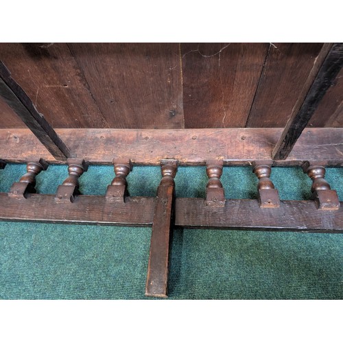 283 - AN ANTIQUE OAK VICTORIAN CARVED BENCH, IN THE JACOBEAN REVIVAL STYLE, HIGH PANELLED BACK WITH HEAVIL... 